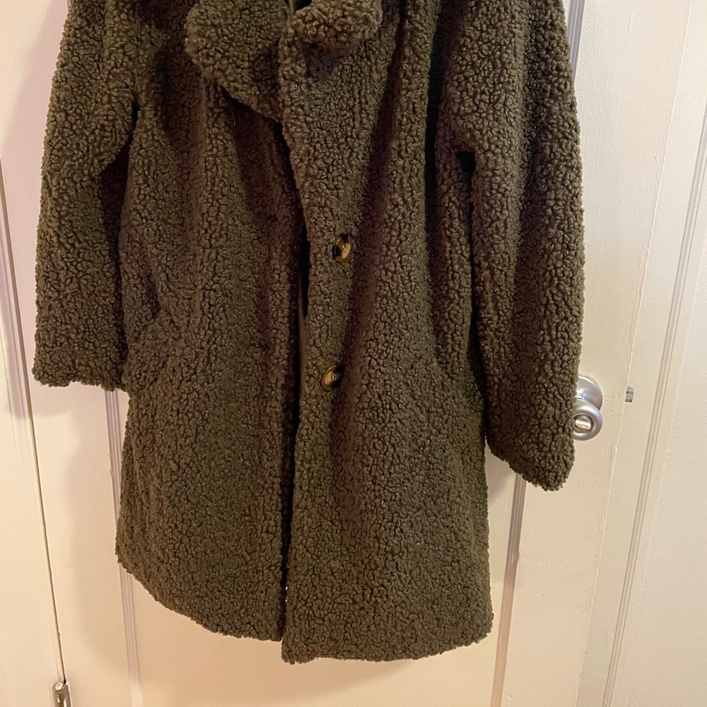Woman’s green coat